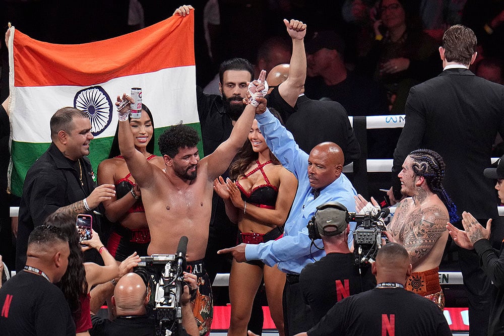 | Photo: AP/Julio Cortez : Goyat vs Nunes Boxing: Neeraj Goyat celebrates after defeating Whindersson Nunes