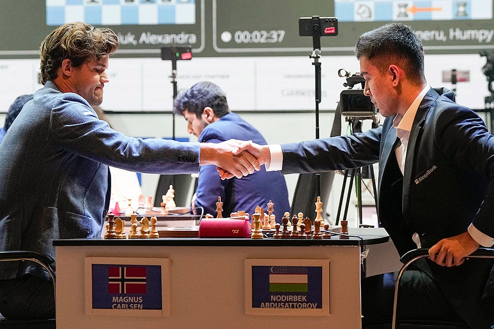 Tata Steel Chess India Rapid Day 3 photo_Magnus Carlsen vs GM Nodirbek Abdusattarov 
