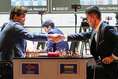 Tata Steel Chess India Rapid: Magnus Carlsen and Uzbek GM Nodirbek Abdusattarov exchange greeting 
