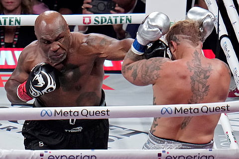 Tyson vs Paul Boxing: Mike Tyson lands a left to Jake Paul