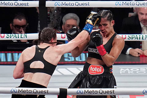 Serrano vs Taylor Boxing: Katie Taylor, left, lands a right to Amanda Serrano 