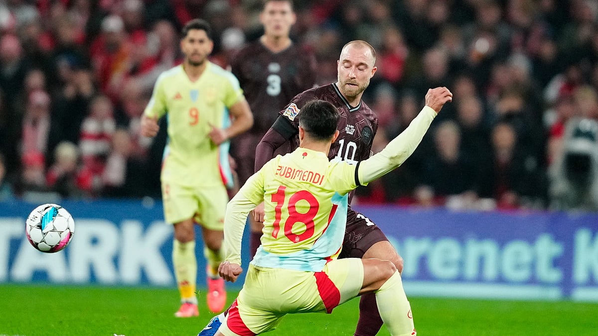 Mads Claus Rasmussen/Ritzau Scanpix via AP : Spain's Martin Zubimendi, front, and Denmark's Christian Eriksen in action during the UEFA Nations League match between Denmark and Spain at Parken in Copenhagen.