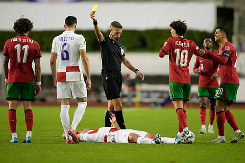 Nations League Soccer: Portugal's Fabio SIlva sees the yellow card after a foul 