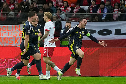 Nations League Soccer: Scotland's Andy Robertson, right, celebrates with his teammates after scoring the second goal