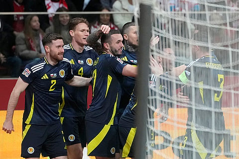 Nations League Soccer: Scotland's John McGinn, center, celebrates with his teammates after scoring the opening goal