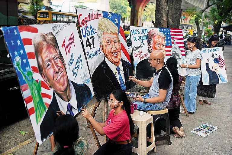 India-US Bonhomie: Students of the Gurukul School of Art paint portraits of Donald Trump in Mumbai on November 6, 2024 - | Photo: AP