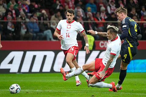 Nations League Soccer: Scotland's Scott McTominay, right, and Poland's Kamil Piatkowski fight for the ball