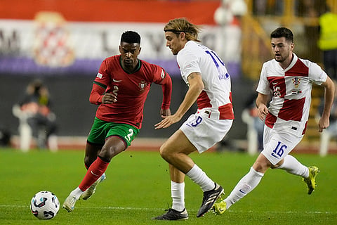 Nations League Soccer: Portugal's Nelson Semedo, left, challenges for the ball with Croatia's Borna Sosa
