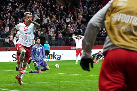 Nations League Soccer: Poland's Kamil Piatkowski, left, celebrates after scoring a goal