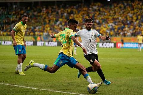Football World Cup 2026 Qualifiers: Brazil's Estevao, left, is challenged by Uruguay's Marcelo Saracchi