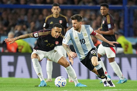 Football World Cup 2026 Qualifiers: Lionel Messi dribbles contested by Peru's Alexander Callens 