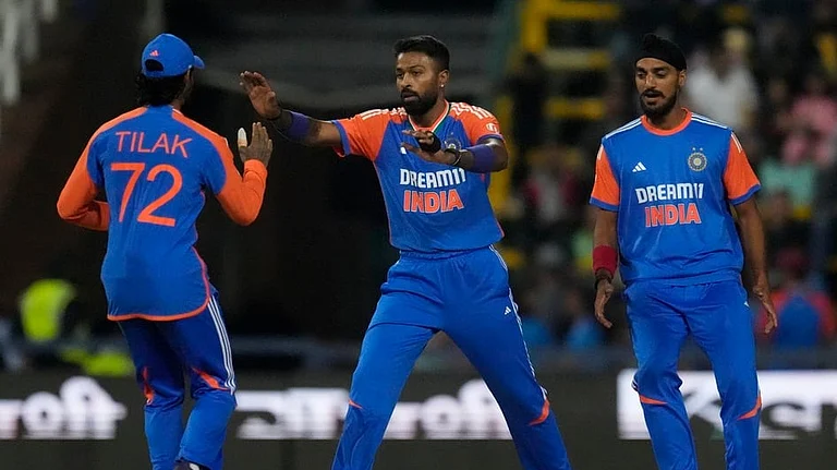 Tilak Varma (L), Hardik Pandya (C) and Arshdeep Singh. - AP/Themba Hadebe