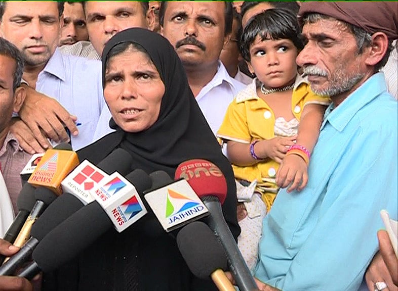 Special Arrangement  : Moithu and his wife Aisha, mourning the loss of their daughter Safia after two decades of delayed justice.