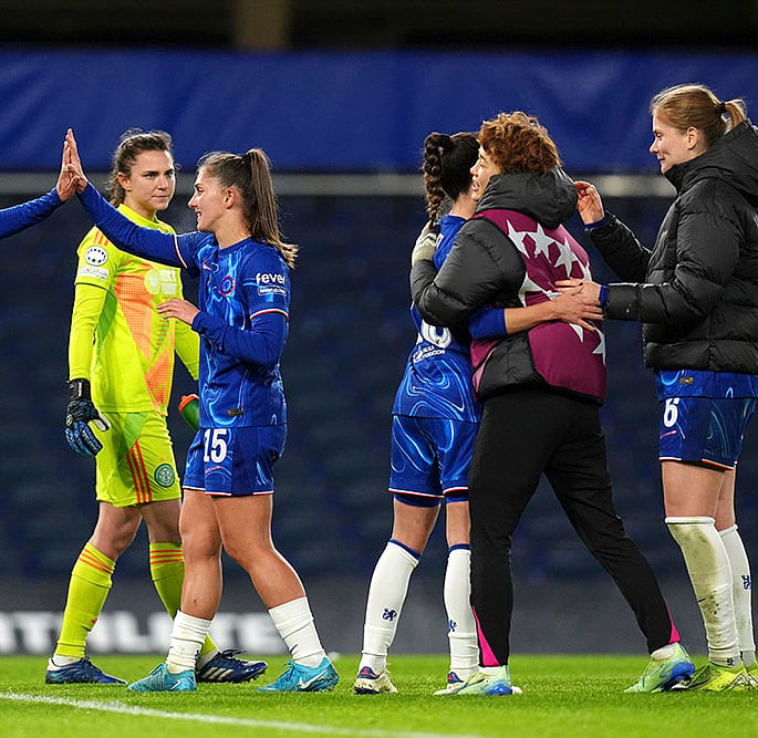 | Photo: John Walton/PA via AP : Chelsea's Mayra Ramirez (left) and Eve Perisset celebrate with team-mates after the final whistle of the match