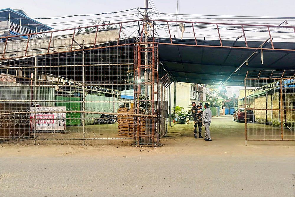 Manipur Minister attempts to protect house from mob attack