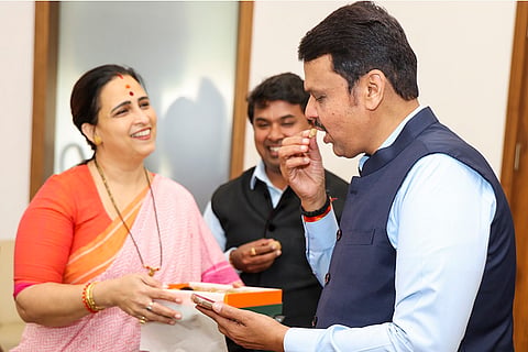 Devendra Fadnavis being greeted by the state BJP Mahila Morcha President Chitra Kishor Wagh
