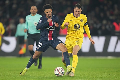 Ligue 1: PSG's Warren Zaire-Emery, left, and Toulouse's Vincent Sierro fight for the ball
