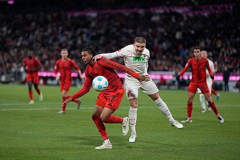 Bundesliga 2024-25: Bayern's Konrad Laimer, challenges for the ball with Augsburg's Mads Valentin