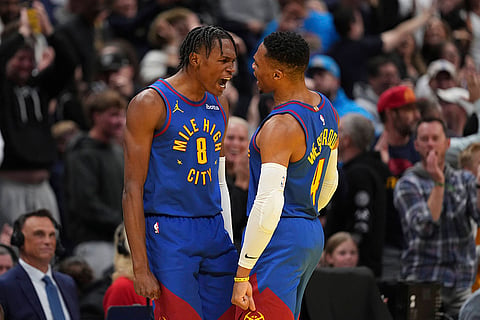 NBA 2024-25: Nuggets forward Peyton Watson (8) celebrates a 3-point basket 