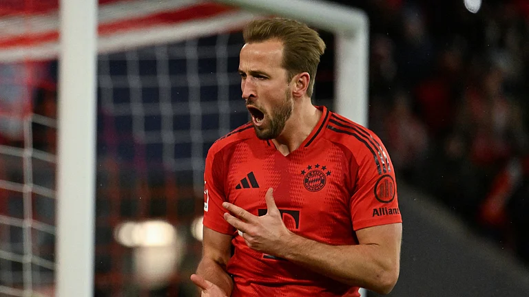 Harry Kane celebrates against Augsburg - null
