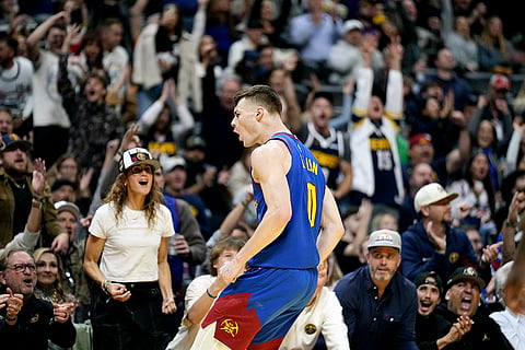 NBA 2024-25: Nuggets guard Christian Braun celebrates a three point basket against the Mavericks