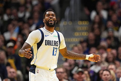 NBA 2024-25: Mavericks forward Naji Marshall celebrates a three point basket against the Nuggets 
