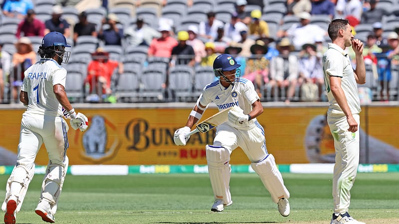Australias captain Pat Cummins, right, reacts. AP Photo
