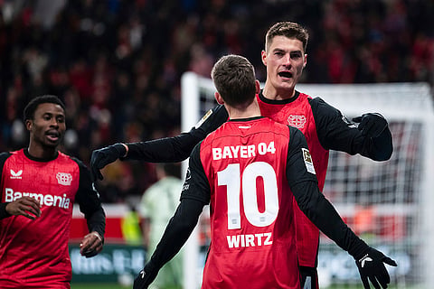 Bundesliga 2024-25: Leverkusen's scorer Patrik Schick, right, and his teammate Florian Wirtz celebrate their side's third goal 