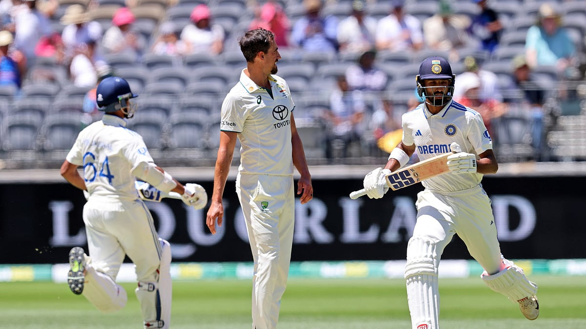 Australias Mitchell Starc watches as Indias Devdutt Padikkal takes a run. AP Photo