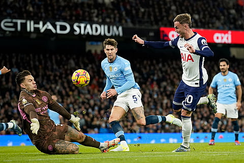 EPL 2024-25: Tottenham's James Maddison, centre right, scores his side's second goal 
