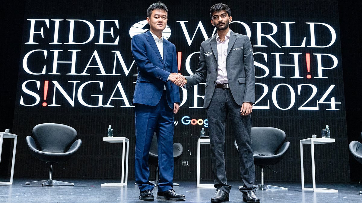 Chinese GM Ding Liren (left) with his Indian competitor D Gukesh at the Press Conference & Opening Ceremony of the FIDE World Championship Match 2024. - FIDE