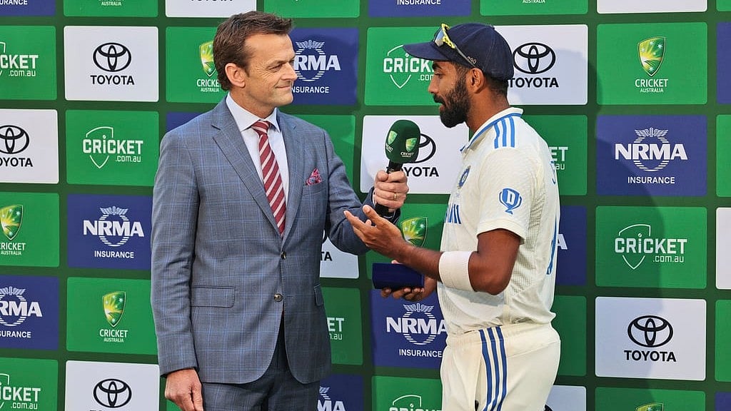 Jasprit Bumrah talking to Adam Gilchrist after the first Test. - AP/Trevor Collens