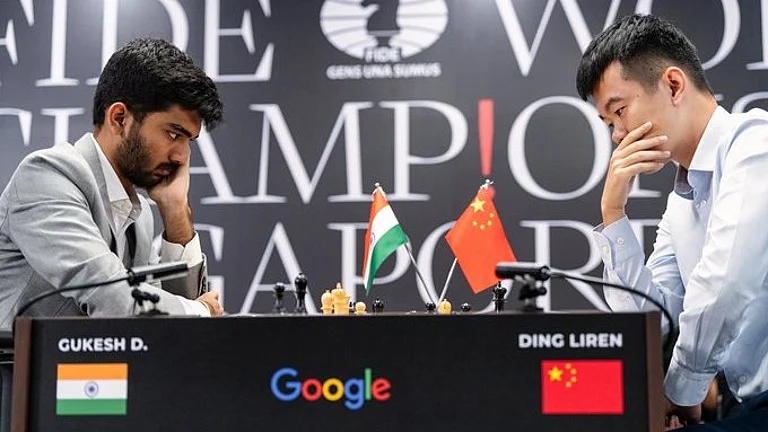 D Gukesh and Ding Liren in action during Game 1 of the World Chess Championship in Singapore. - X/FIDE