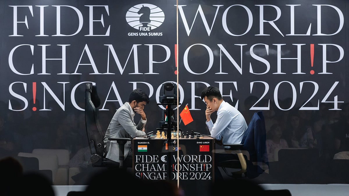 FIDE : D Gukesh (left) with his Chinese opponent Ding Liren at the game 1 of the World Chess Championships.