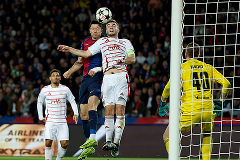 UEFA Champions League: Barcelona's Robert Lewandowski jumps for the ball against Brest's Brendan Chardonnet
