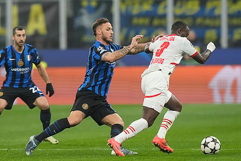 UEFA Champions League: Leipzig's Lutsharel Geertruida, right, is challenged by Inter Milan's Marko Arnautovic