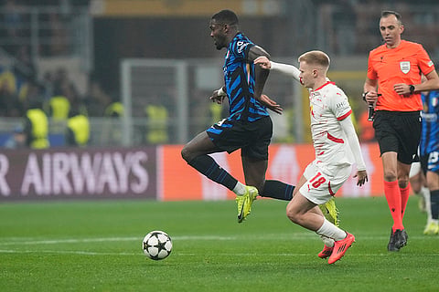 UEFA Champions League: Inter Milan's Marcus Thuram is challened by Leipzig's Arthur Vermeeren