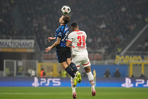 UEFA Champions League: Inter Milan's Nicolo Barella, left, and Leipzig's Benjamin Henrichs jump for a header