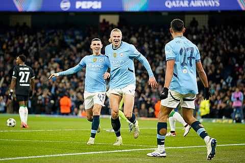 UEFA Champions League: City's Erling Haaland, center, celebrates with Phil Foden, left, and Matheus Nunes after scoring his side's third goal