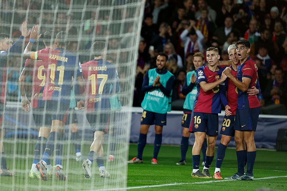 | Photo: AP/Joan Monfort : UEFA Champions League: Barcelona's Dani Olmo celebrates his side's fourth goal 