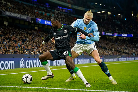 UEFA Champions League: Feyenoord's Jordan Lotomba is challenged by Manchester City's Erling Haaland