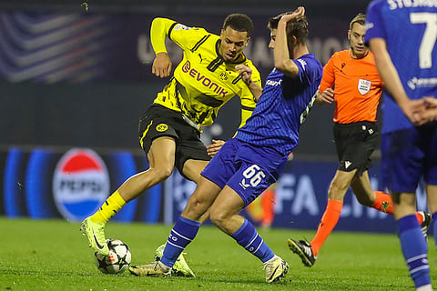 Champions League 2024-25: Dortmund's Felix Nmecha, left, is challenged by Dinamo's Branko Pavic 