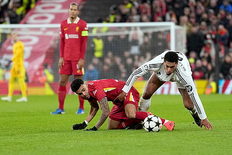 Champions League 2024-25: Real Madrid's Jude Bellingham, right, fights for the ball with Liverpool's Luis Diaz 