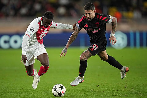 Champions League 2024-25: Monaco's Folarin Balogun, left, and Benfica's Nicolas Otamendi fight for the ball 
