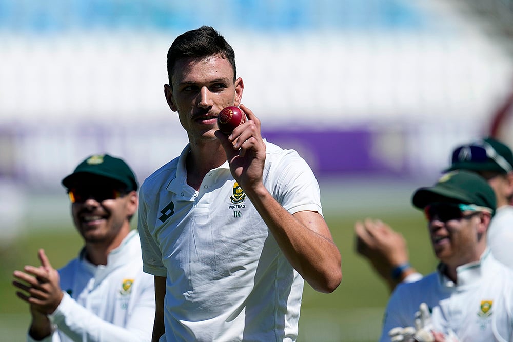 | Photo: AP/Themba Hadebe : RSA Vs SL, 1st Test: South Africa's Marco Jansen leaves the field as he holds the ball after taking seven wickets 
