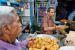 | Photo: Vikram Sharma : Popular Haunts: Bedmi Puri and aloo ki sabzi being served