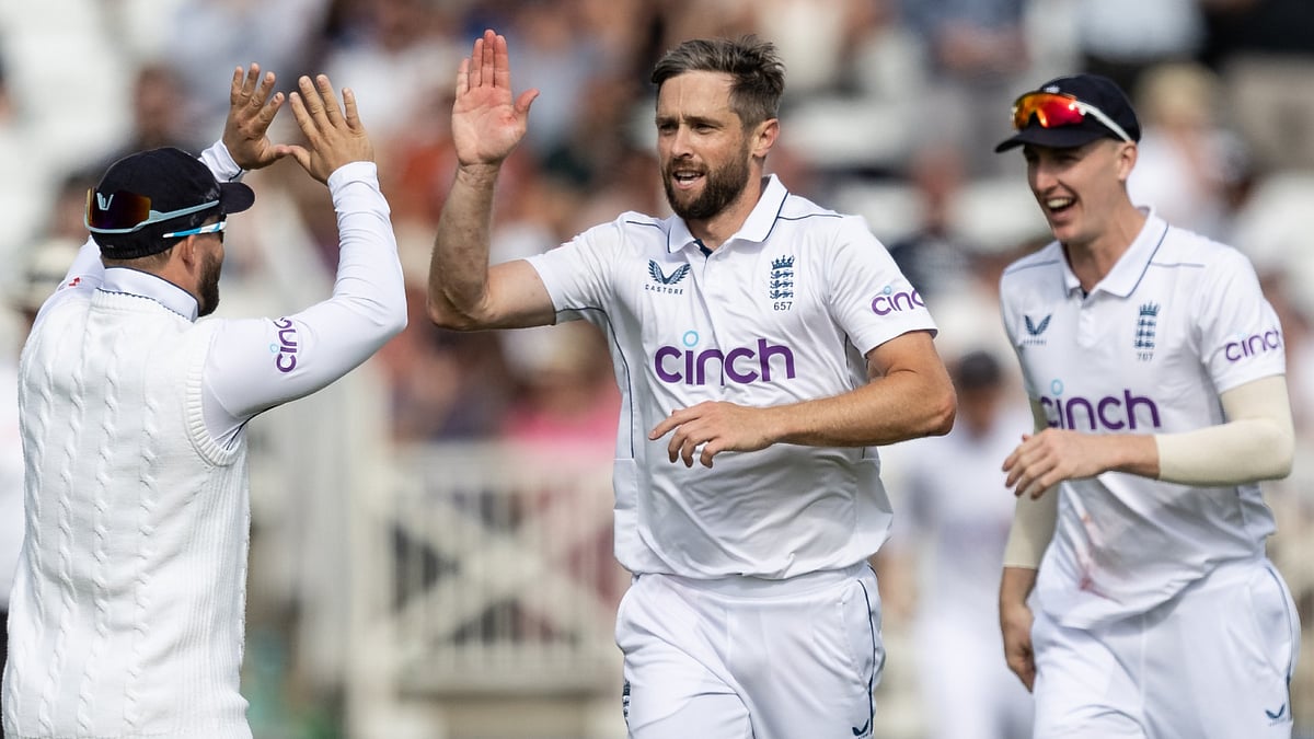 File : Chris Woakes took two consecutive wickets in Christchurch to put England on the brink of victory