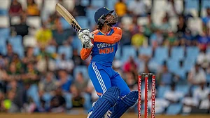 | Photo: AP/Themba Hadebe : Tilak Varma belts Anrich Nortje out of the ground in the 1st T20I at the Baraspati Stadium in Cuttack.