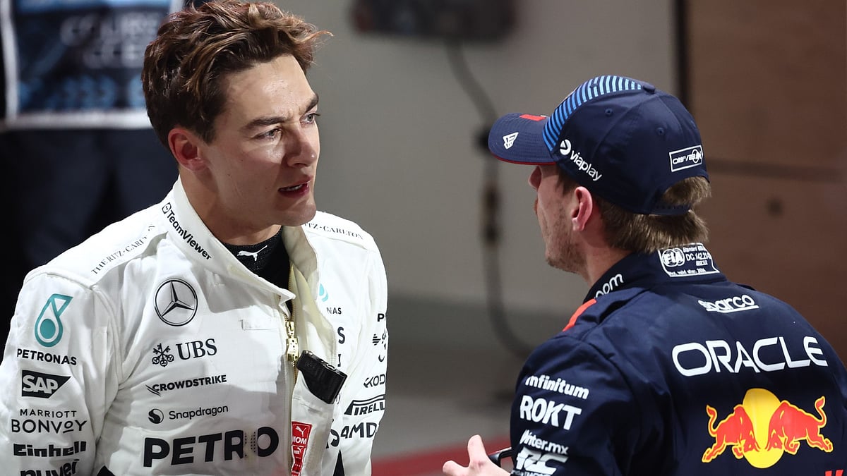 George Russell and Max Verstappen. - null