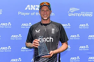 | Photo: John Davidson/Photosport via AP : NZ vs ENG 1st Test: England's Brydon Carse poses with his-man-of-the-match trophy